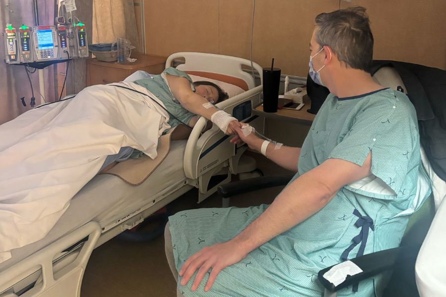 Mike Wise sits next to the beside of his friend receiving an organ donation.